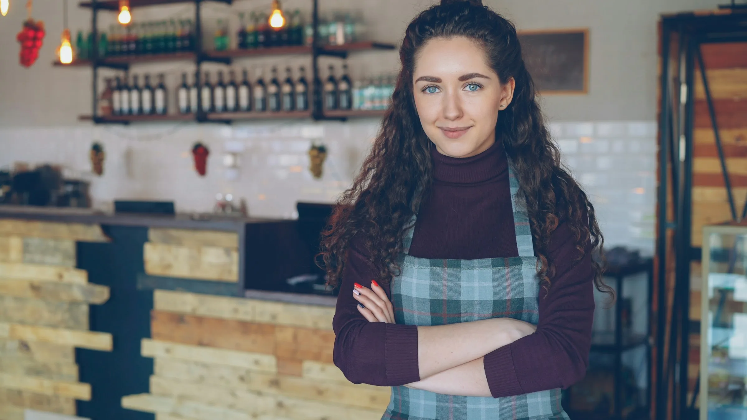 Local business owner standing confidently in her shop